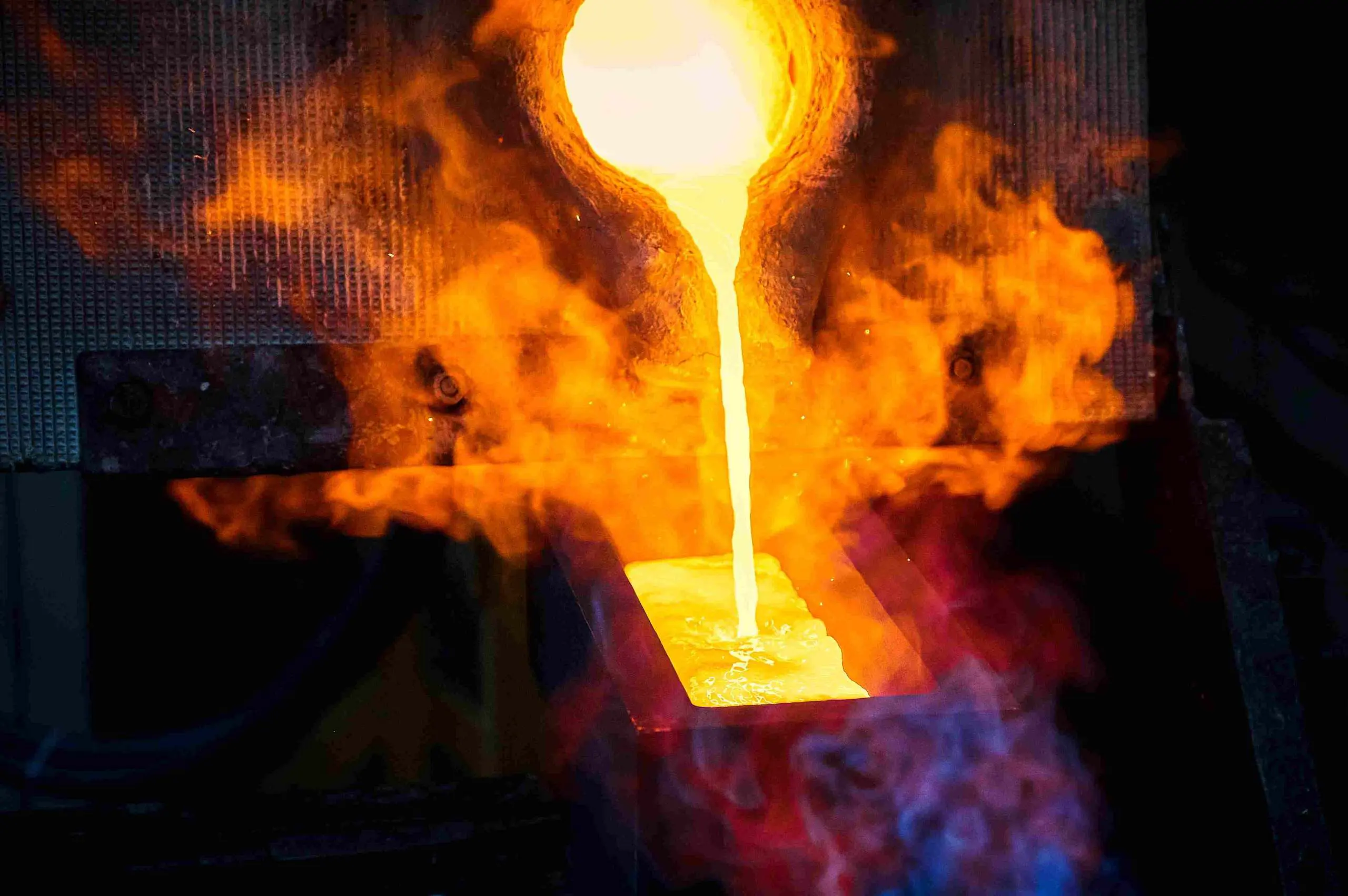 Gold pour during final stage of gold production, representing Delonix Solutions’ end-to-end processing infrastructure support.